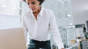 woman looking at laptop screen